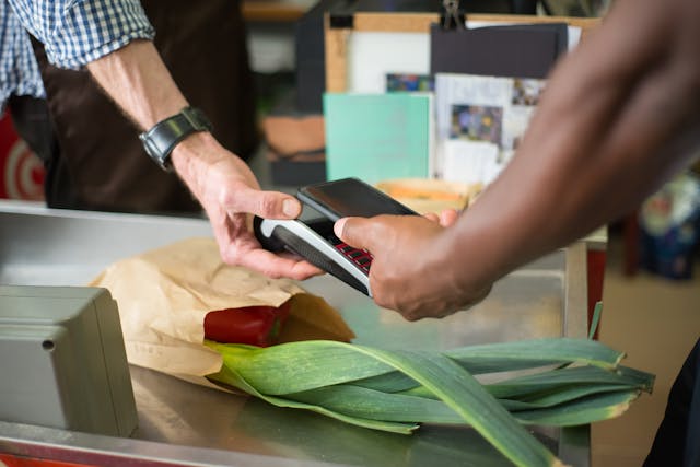 Paying for groceries at checkout